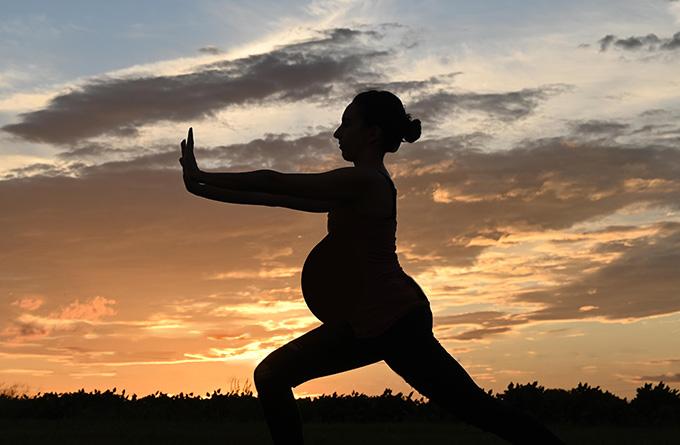 Image of a pregnant woman doing simple tai chi