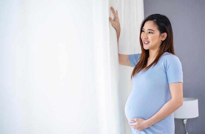 A Pregnant Woman Looking Happy